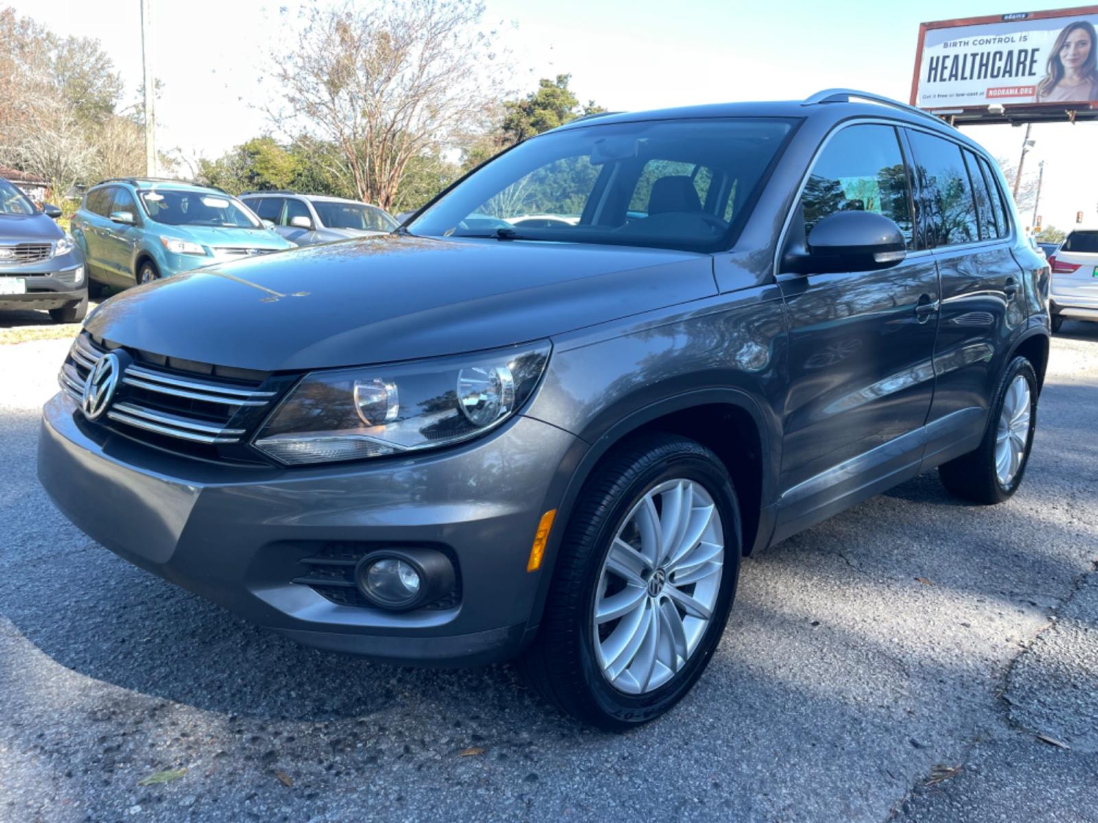2015 GRAY VOLKSWAGEN TIGUAN S (WVGAV7AX3FW) with an 2.0L engine, Automatic transmission, located at 5103 Dorchester Rd., Charleston, SC, 29418-5607, (843) 767-1122, 36.245171, -115.228050 - Local Trade-in with Leather, Panoramic Sunroof, Navigation, Backup Camera, Fender Stereo with CD/AUX/Bluetooth, Dual Climate Control, Power Everything (windows, locks, seats, mirrors), Heated Seats, Push Button Start, Keyless Entry, Alloy Wheels. Clean CarFax (no accidents reported!) 102k miles Loc - Photo #2